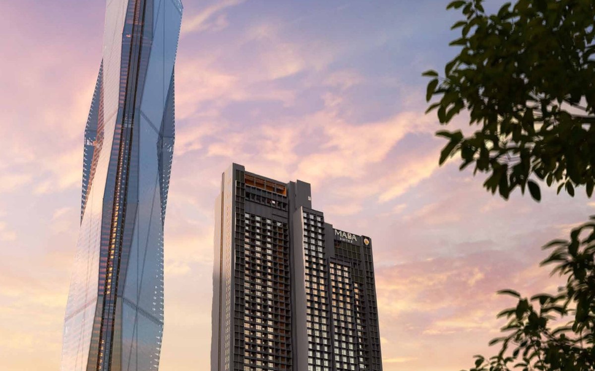 The MABA Suitez towers beside Menara Merdeka Maybank at dusk