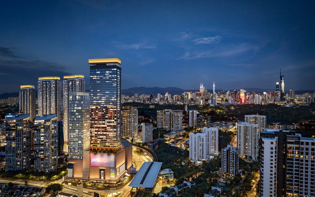 Pavilion Damansara Heights at night with the Kuala Lumpur skyline behind