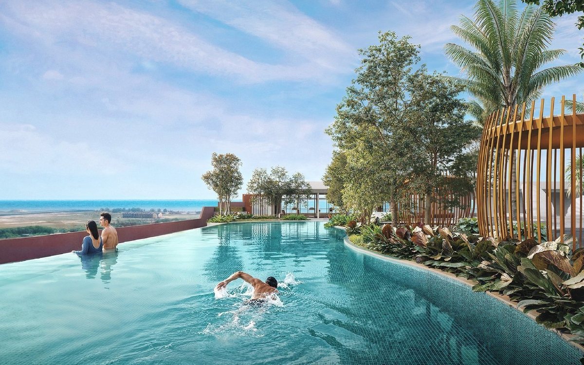 Infinity lap pool at Tagbay Suites with a view over the Melaka sea