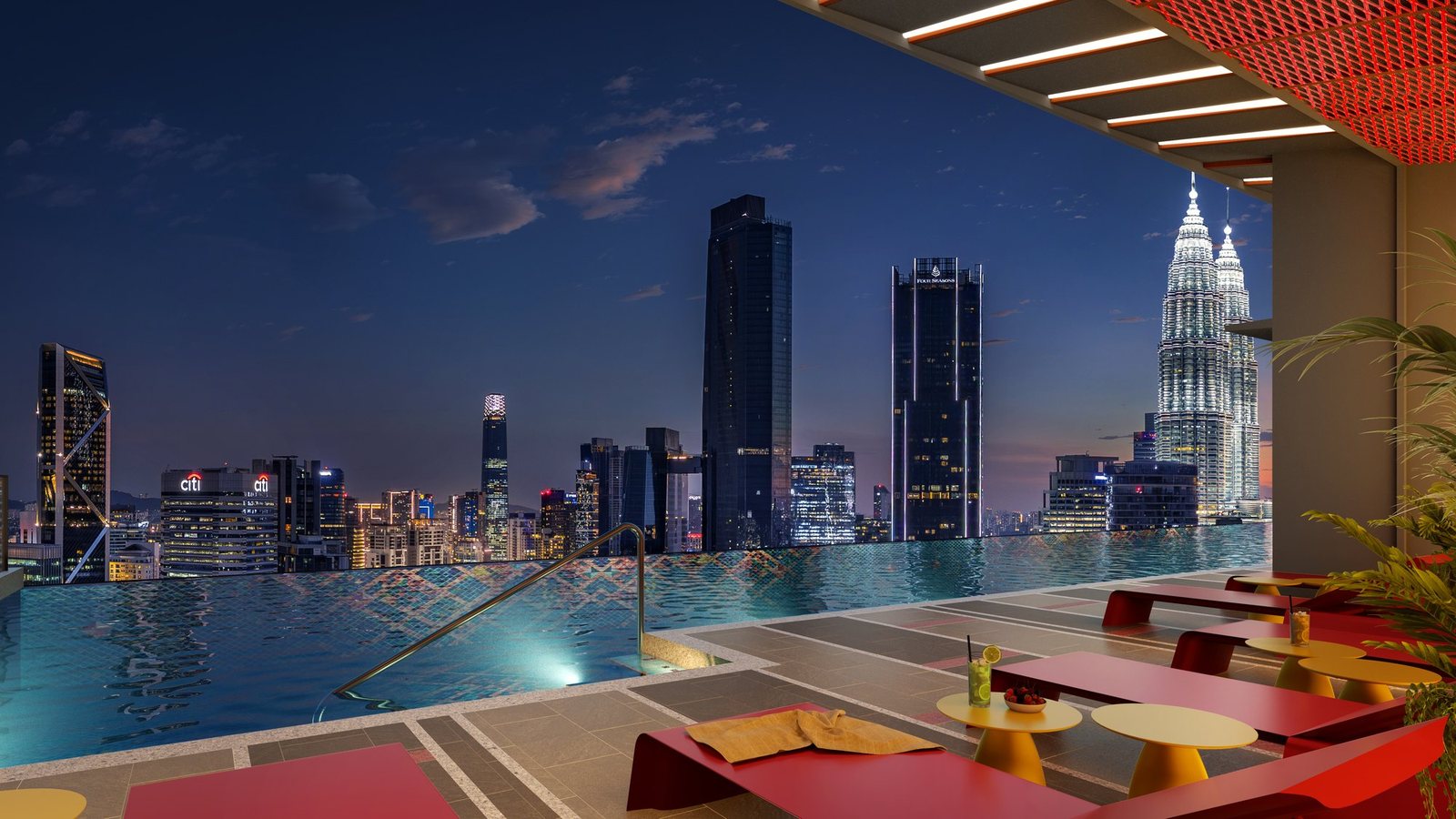 Sky pool deck at night at Phoeniz Suites KL City Centre with the KLCC skyline
