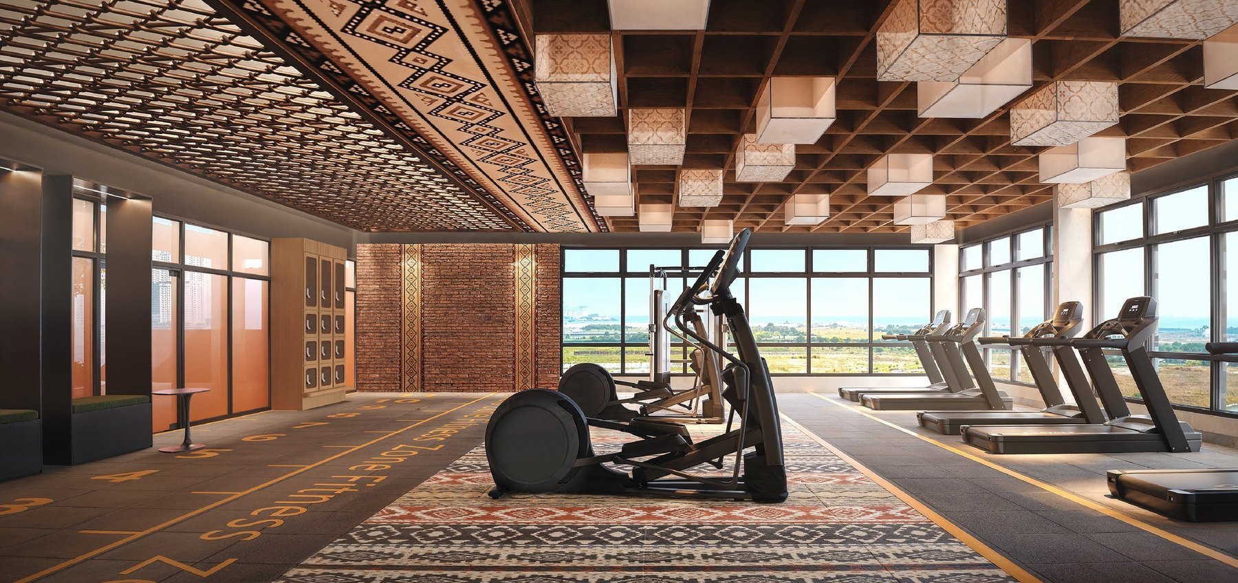 Gymnasium at Tagbay Suites overlooking the coast